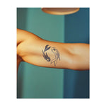 Due pesci che nuotano in direzioni opposte. Simboleggiano l'equilibrio, l'armonia o il concetto di yin e yang.